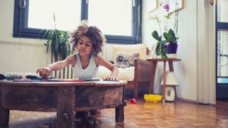 Young girl drawing at home