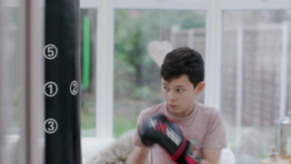 Jake boxing with boxing gloves